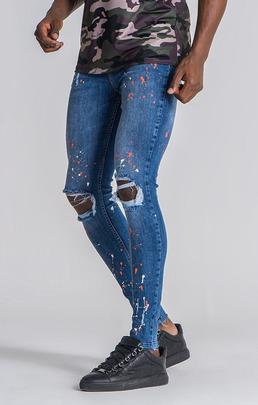 PANTALÓN VAQUERO ELÁSTICO CON SALPICADURAS DE PINTURA NEÓN