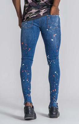 PANTALÓN VAQUERO ELÁSTICO CON SALPICADURAS DE PINTURA NEÓN